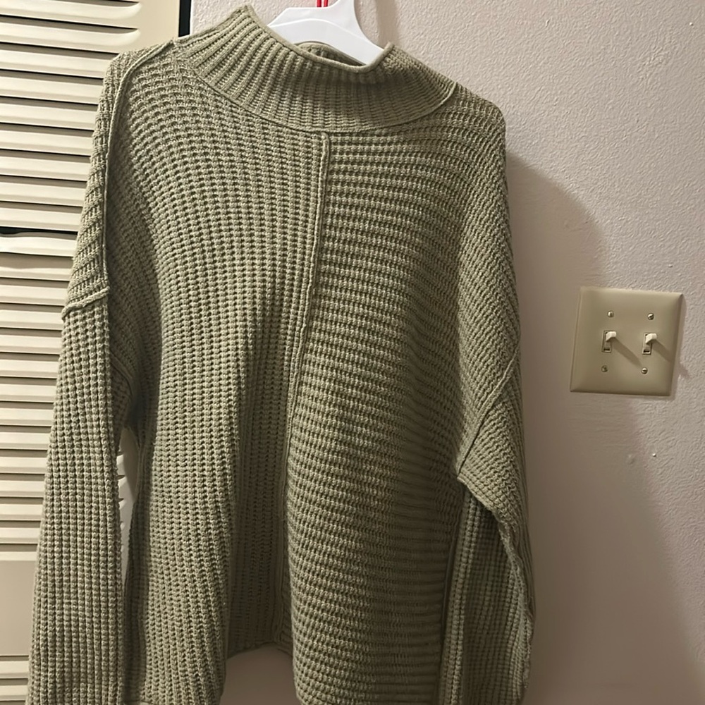 Green turtleneck sweater